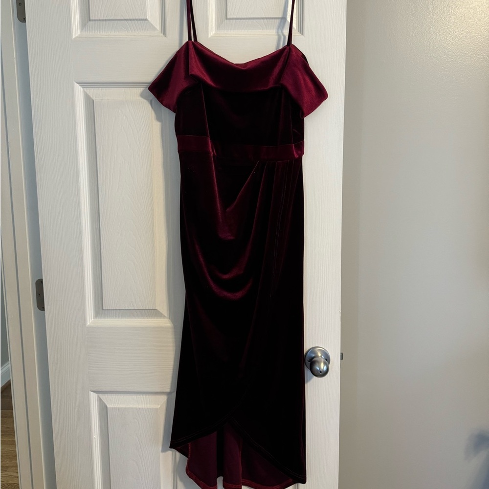 Maroon colored velvet formal dress.